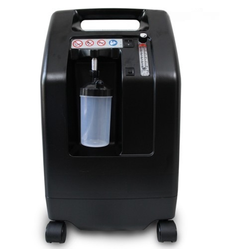 DeVilbiss 5 LPM oxygen concentrator on rent in Chennai — front view with humidifier bottle and flow meter